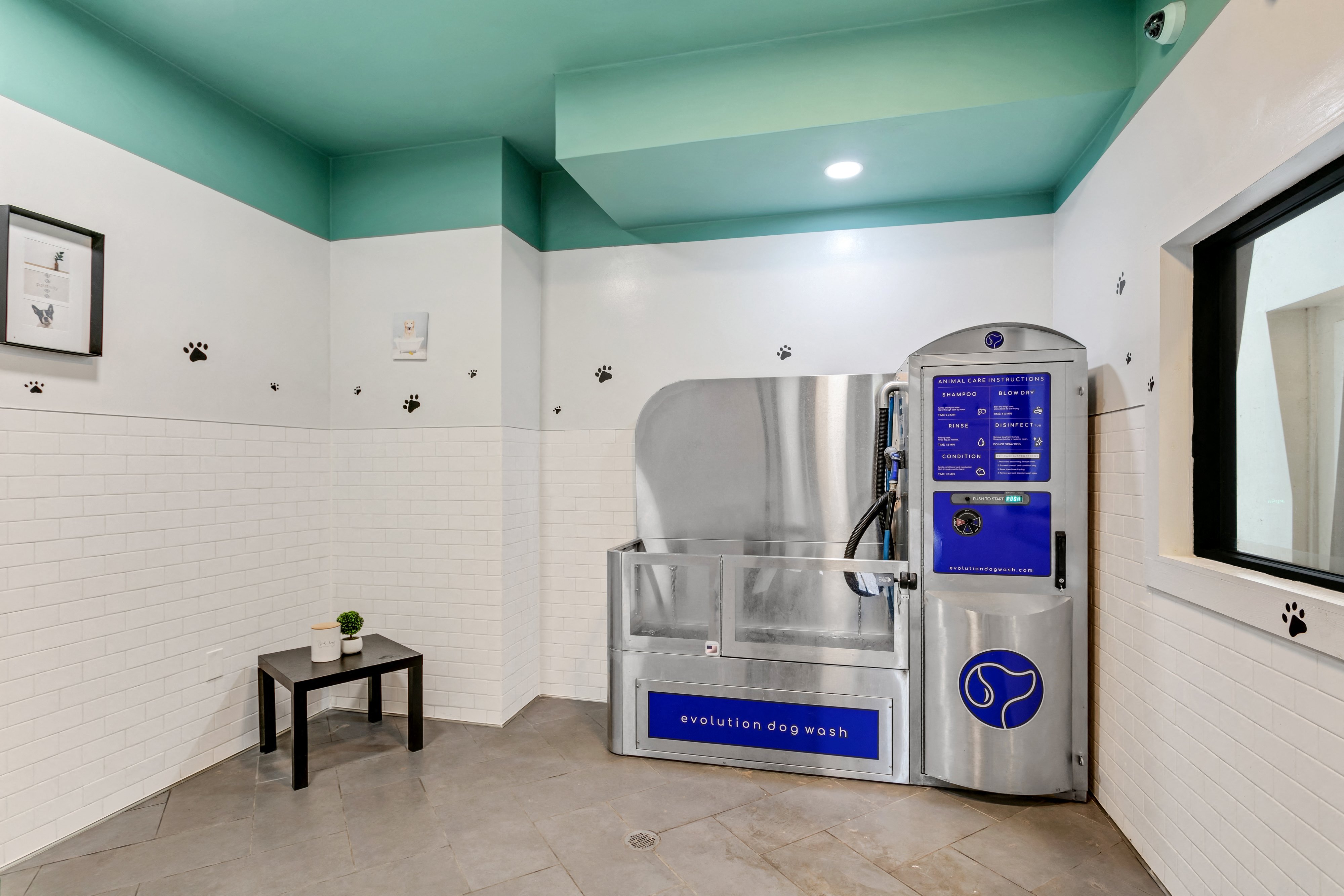 a refrigerator in a room with a window and a table
