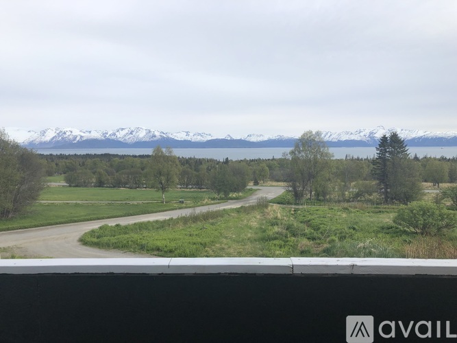 A mountain range with snow capped peaks in the distance.