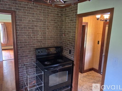 A room with wooden floors and a ceiling fan.