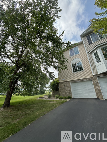 A house with a tree in front of it.