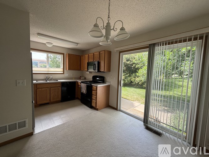 A kitchen with a dishwasher and a microwave.