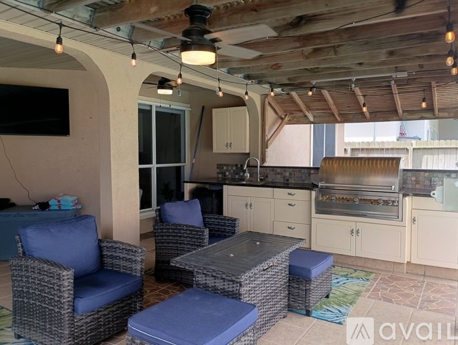 A patio with a table and chairs.