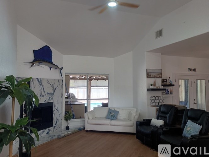A living room with a fireplace and a couch.