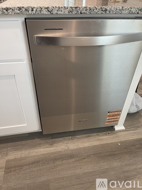 A stainless steel dishwasher in a kitchen.