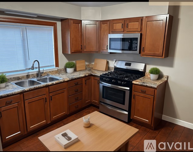 A kitchen with wooden cabinets and a stainless steel oven.
