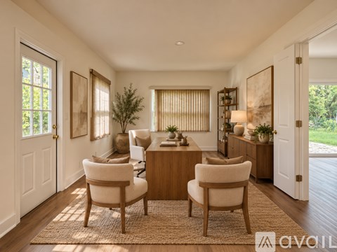 A living room with a brown rug and two chairs.