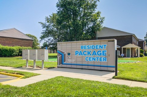 a sign for the resident package center in front of a building