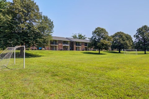 a soccer field in front of a building