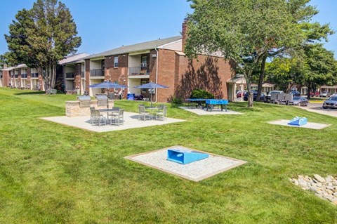 our apartments have a spacious yard with picnic tables and umbrellas
