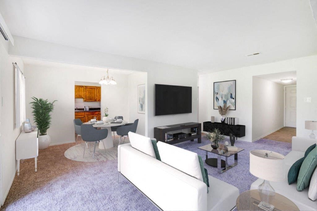 a living room with a white couch and a table