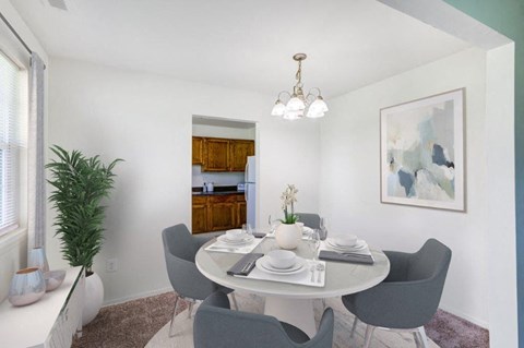 a dining room with a table and chairs
