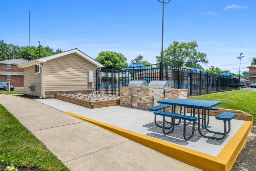 our picnic table and grill are next to our playground