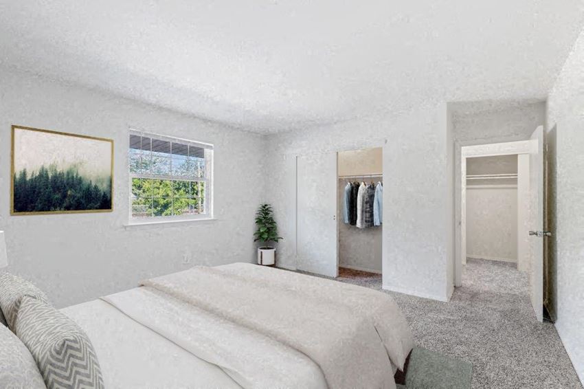 a bedroom with a bed and a closet