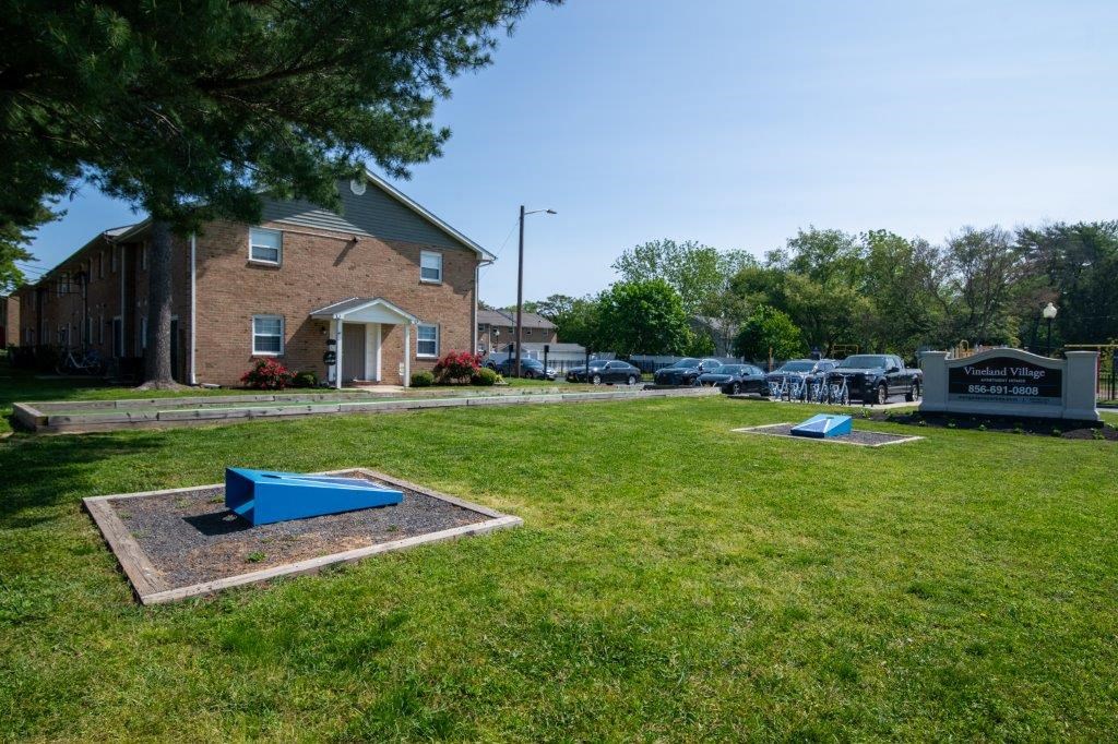 a cemetery in front of a brick building