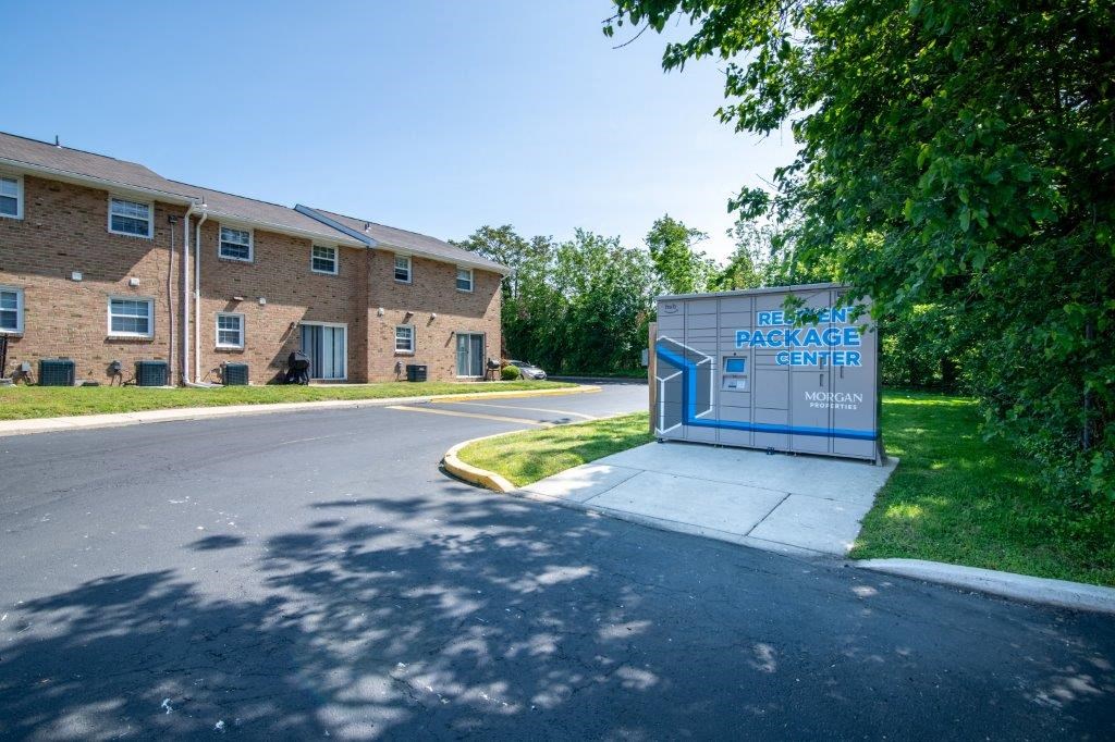a building with a sign on the side of a road