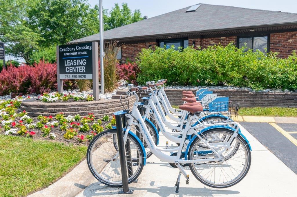 a row of bikes parked in front of leasing center