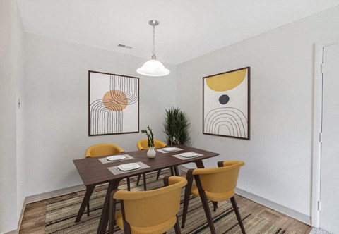 a dining room with a wooden table and chairs