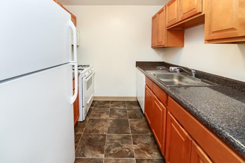a kitchen with a sink and a refrigerator