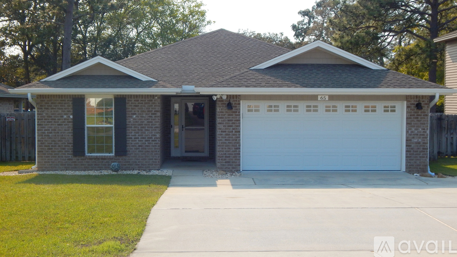 A house with a white garage door is for sale.