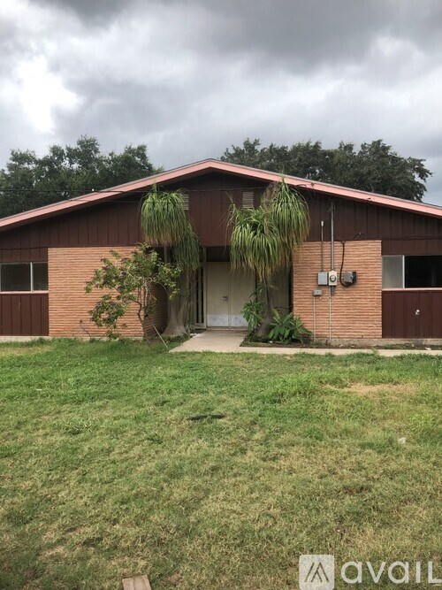 A house with a brown roof and a white door.
