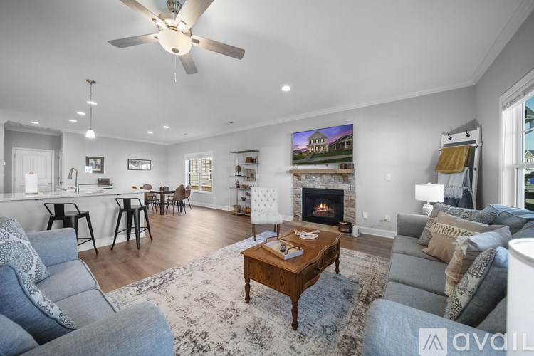 A living room with a grey couch and a coffee table.