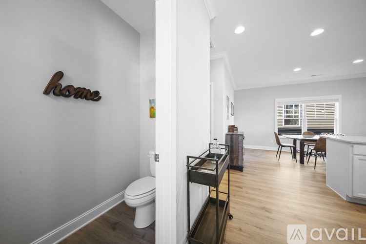 A white bathroom with a toilet and a sink.