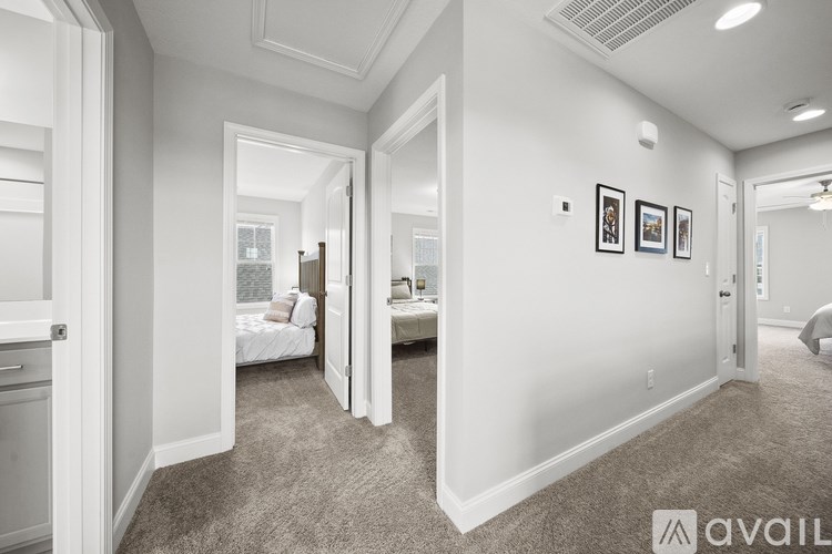 A bedroom with a bed, dresser, and mirror.