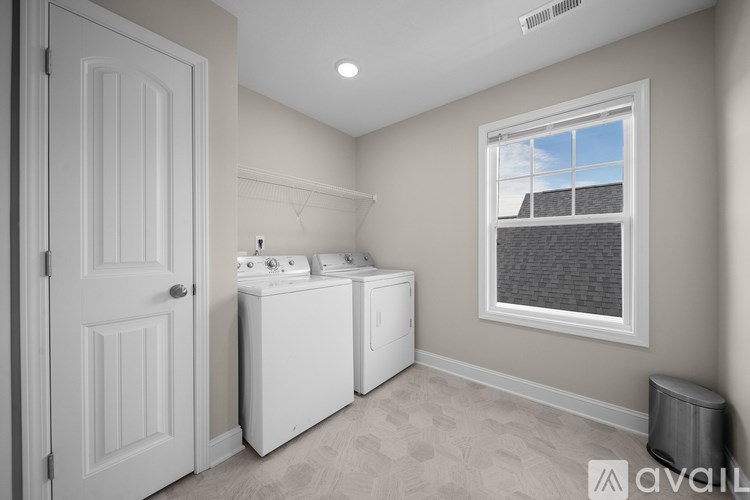 A laundry room with a washer and dryer.