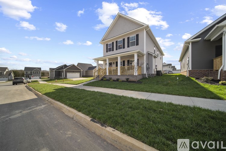 A house with a car parked in front of it.