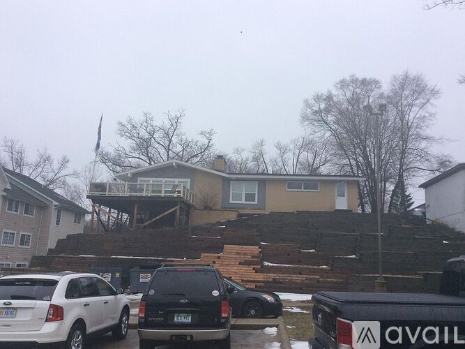 A house with a car parked in front of it.