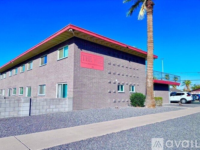 A building with a red roof and a sign that says "The Villa".