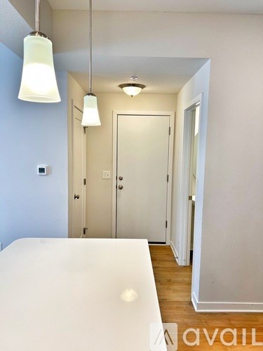 A bedroom with a bed and a door.