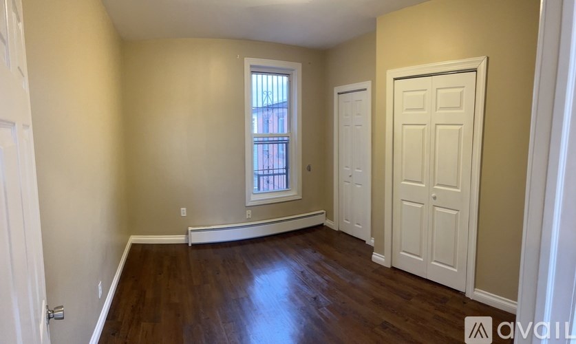 A room with a window and a door.