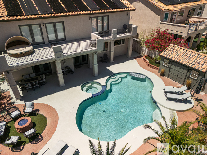 A large house with a pool in the backyard.