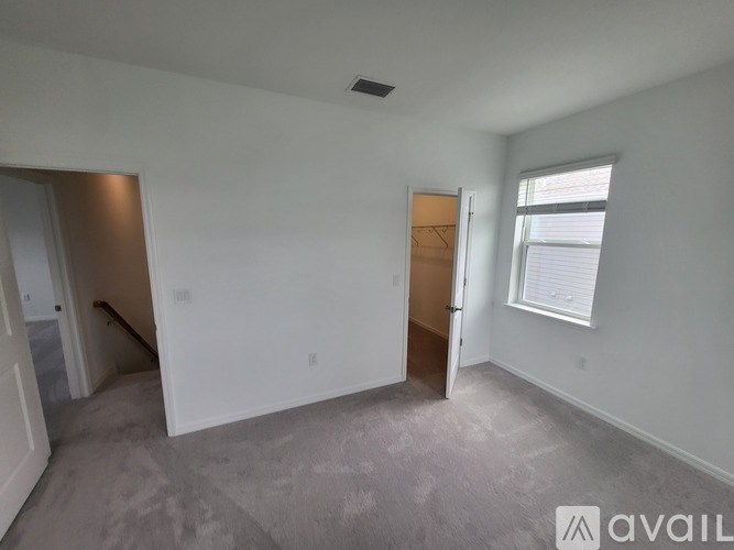 A room with a door and a window is available for rent.