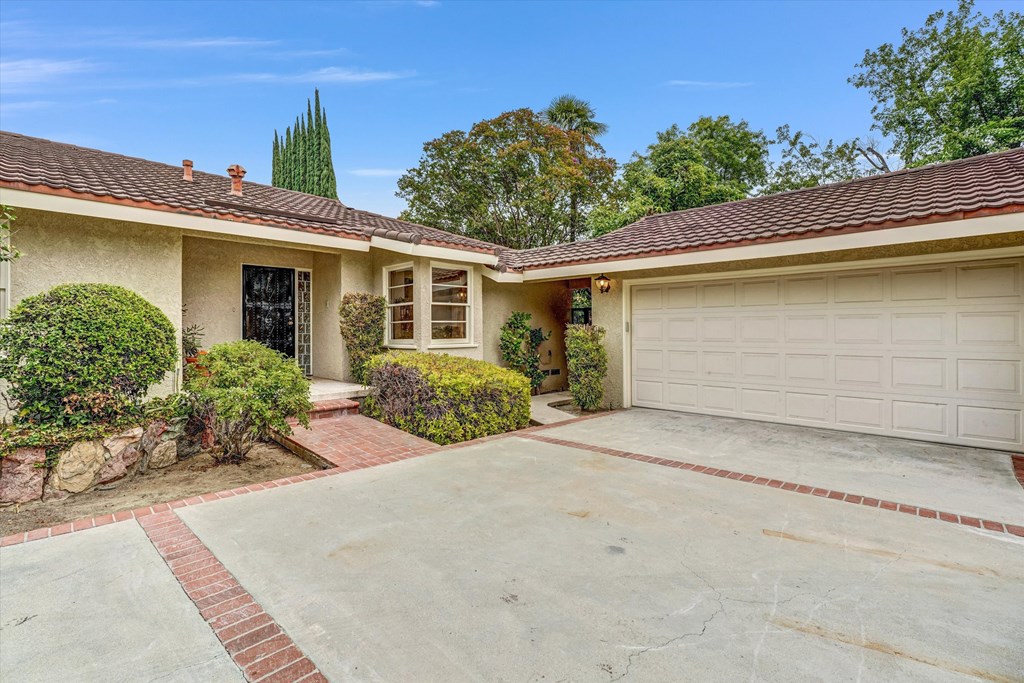 A house with a driveway and a garage.