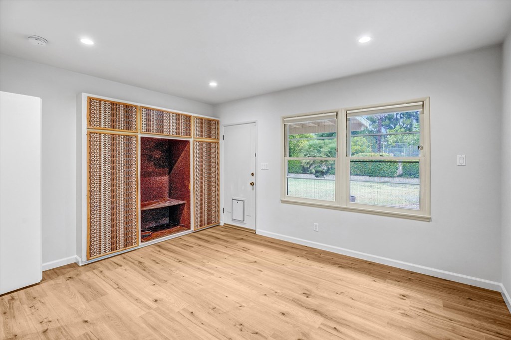 A room with a window and a door.