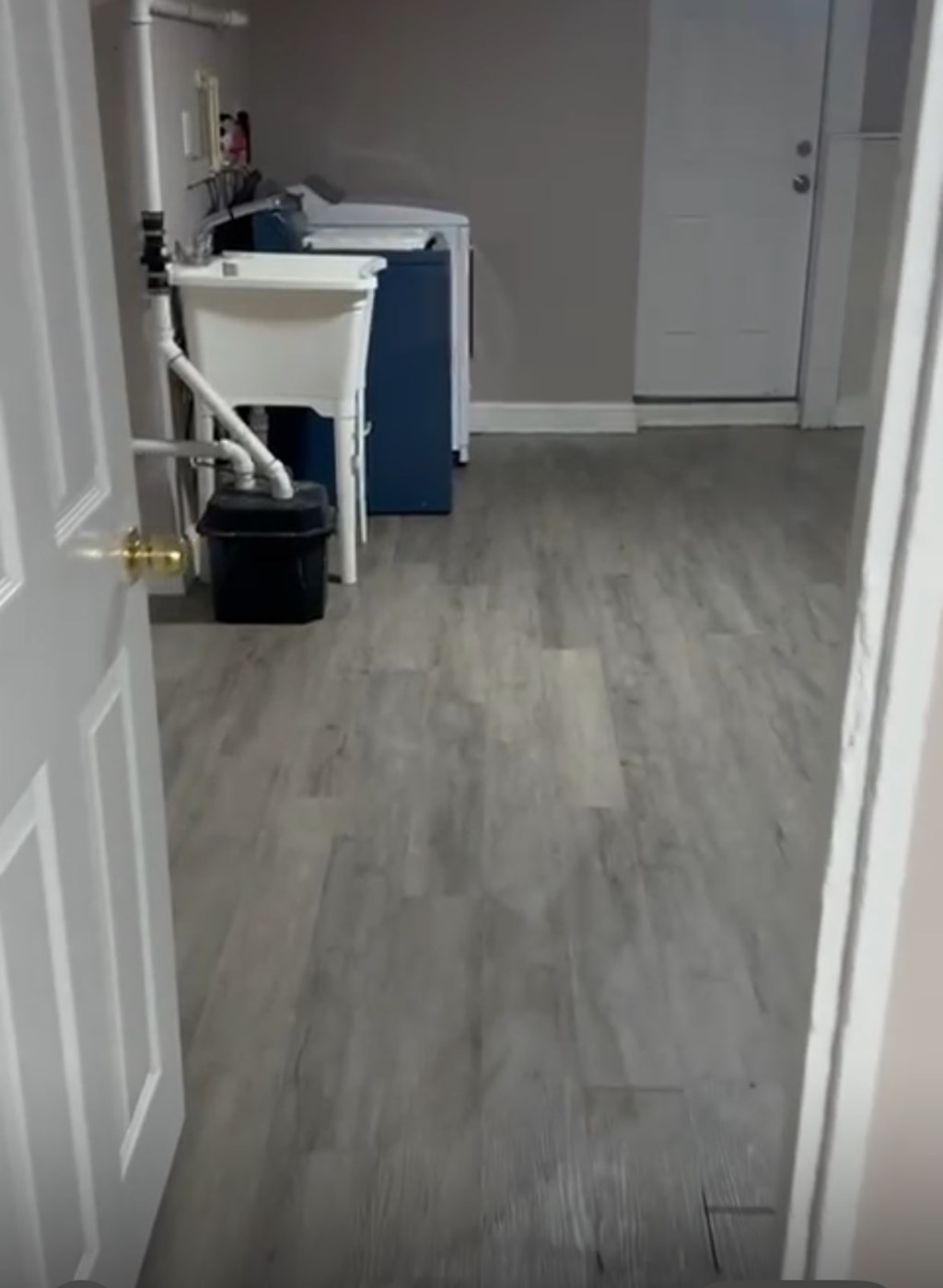 A bathroom with a white sink and a white toilet.