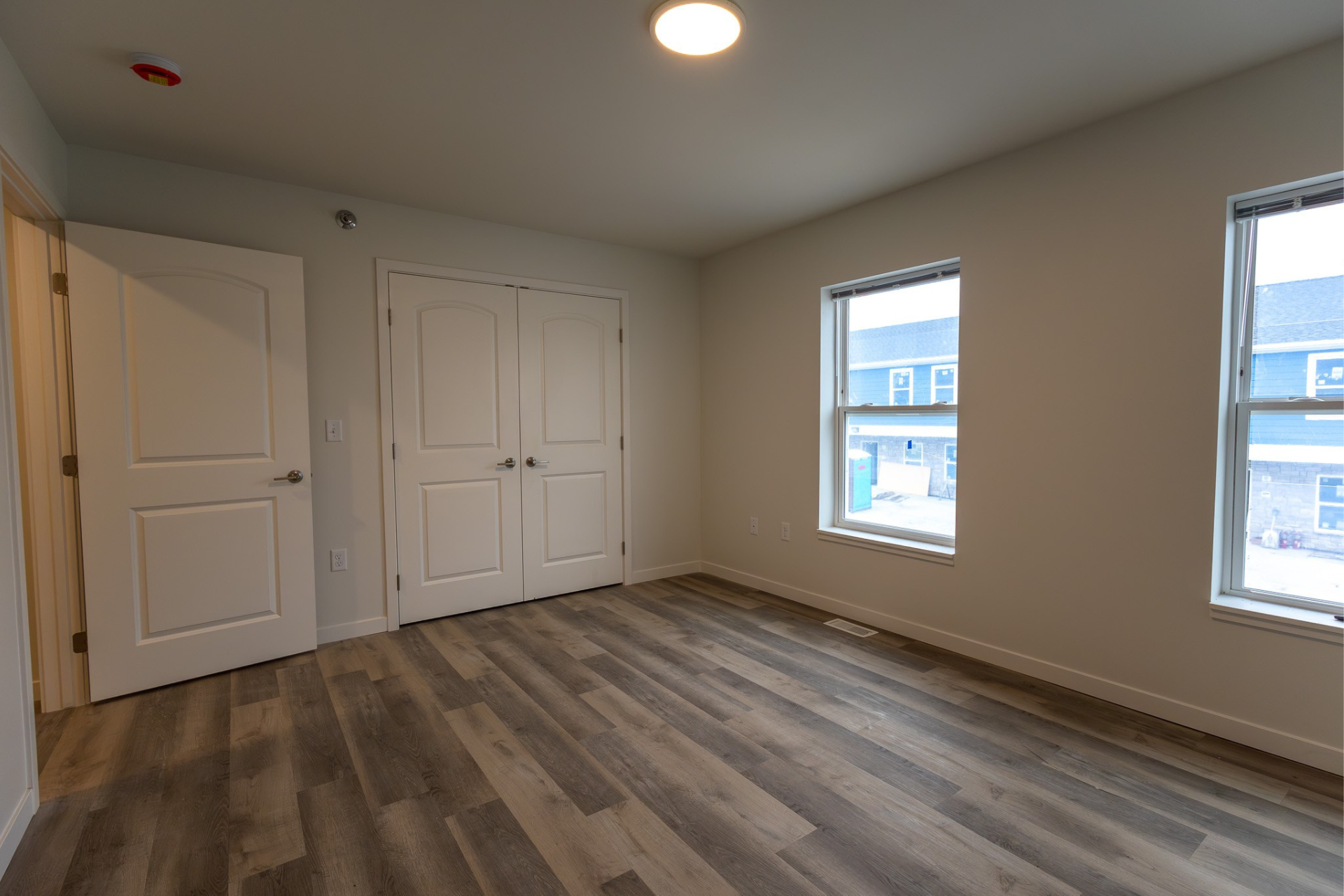 Bedroom with large windows.