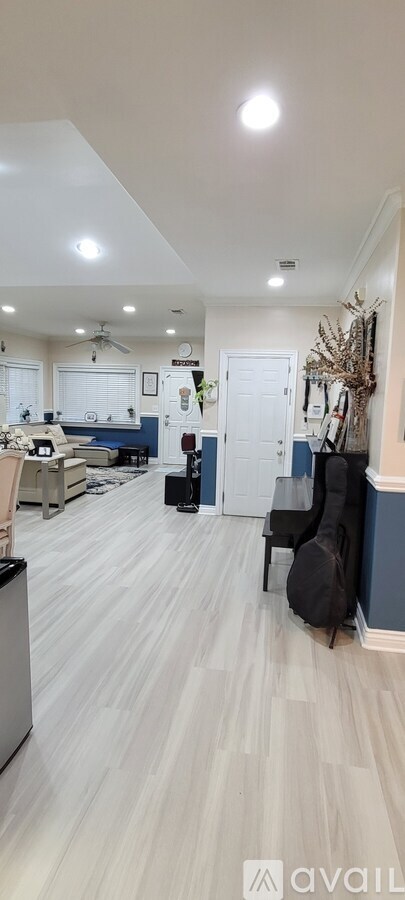 A room with a white ceiling and a light on.