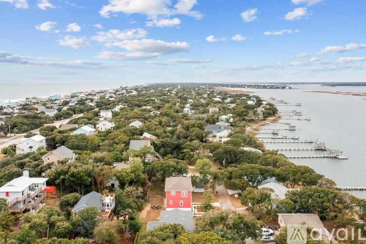 A bird's eye view of a residential area with houses and boats.