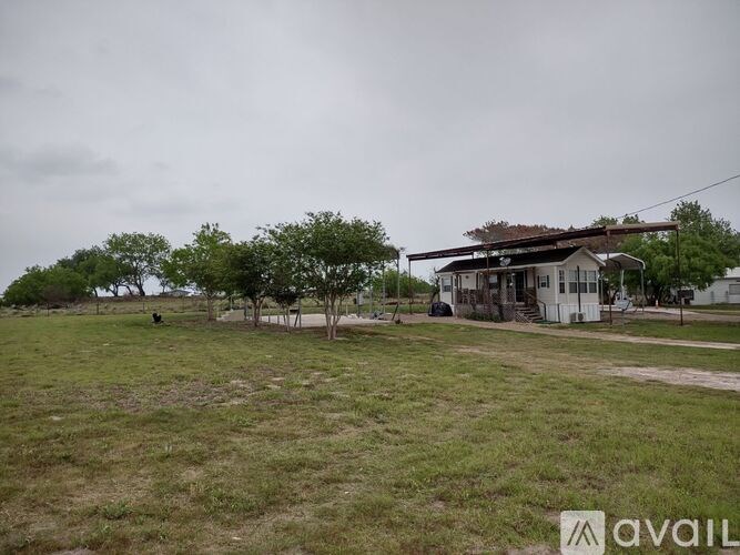 A house with a lawn in front of it.