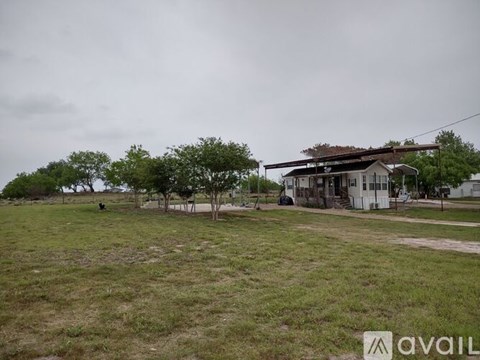 A house with a lawn in front of it.