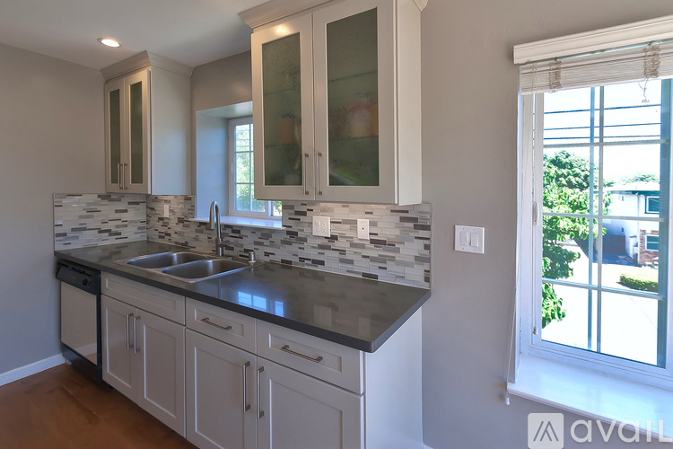 A kitchen with a sink and cabinets.