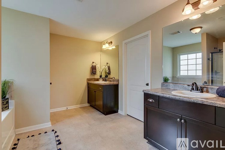 A bathroom with a vanity and a mirror.