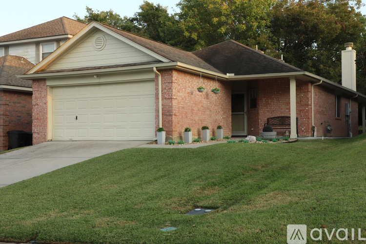 A house with a garage and a chimney.
