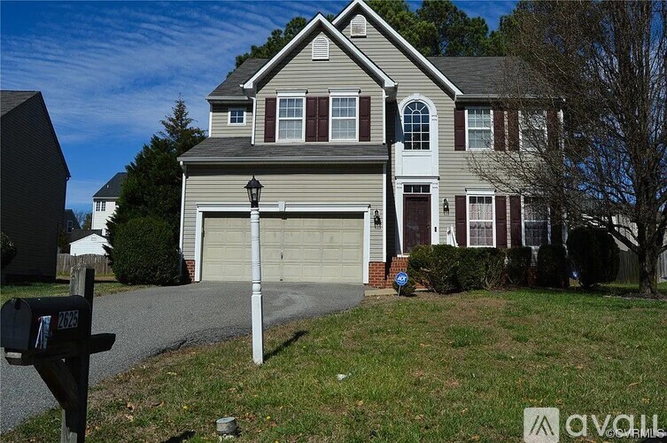 A house with a grey garage door is for sale.