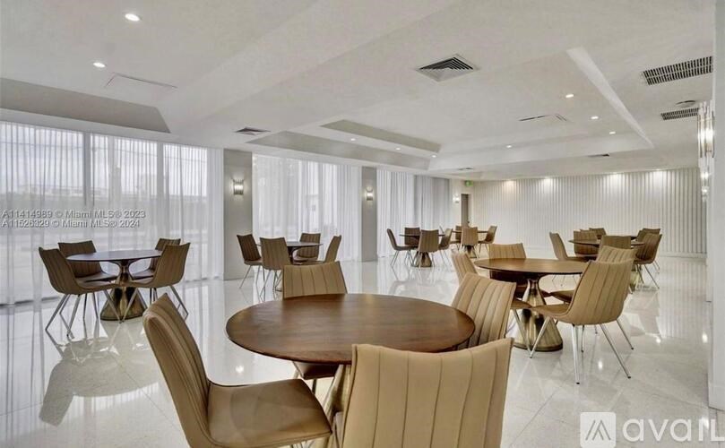 A modern dining room with wooden tables and chairs.