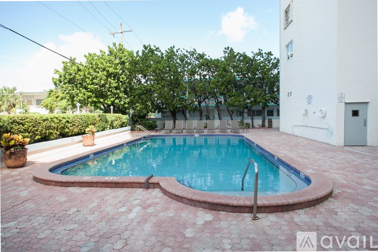 A small pool with a red brick border.