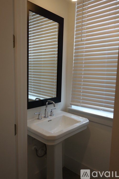 A bathroom sink with a mirror above it.